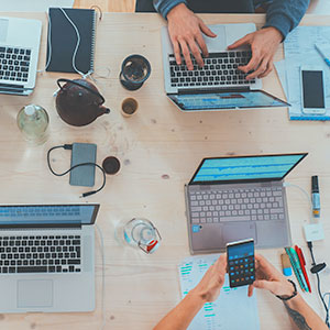 Desktop with two coders working